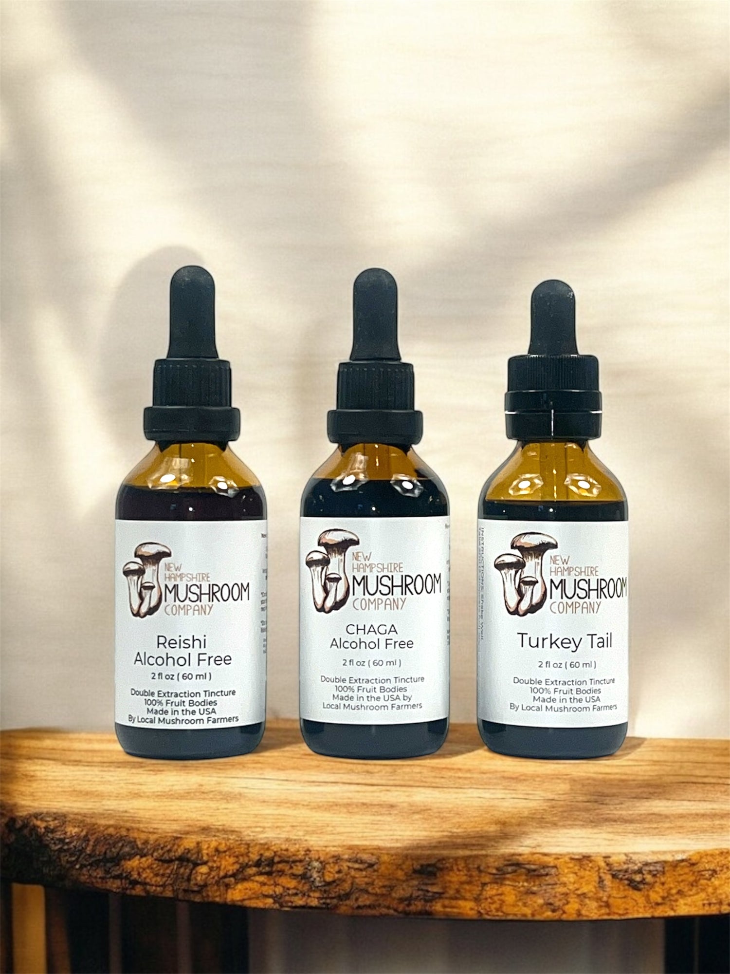 Daily Defense Trio by NH Mushroom Company – bundle of Reishi, Chaga, and Turkey Tail tinctures for daily immune support, made from double-extracted fruiting bodies.
